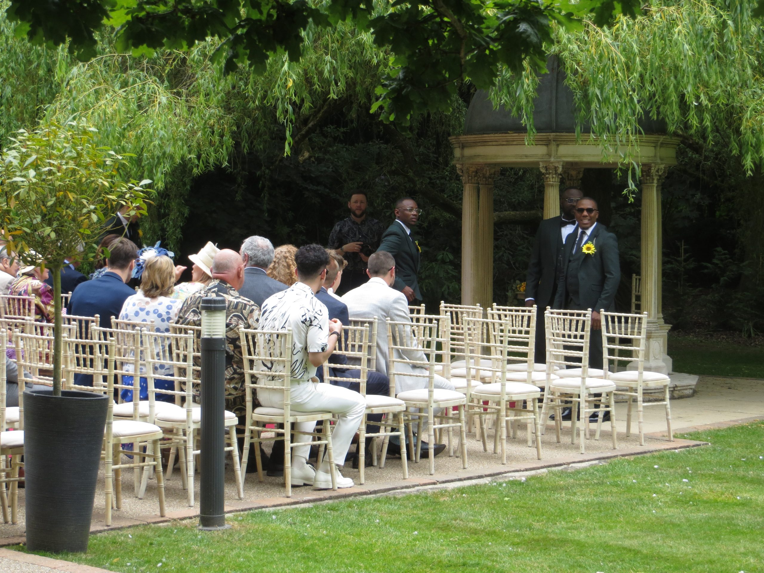 Ceremony garden wedding Wedding DJ For Hire In Norfolk guests and groom waiting for the bride