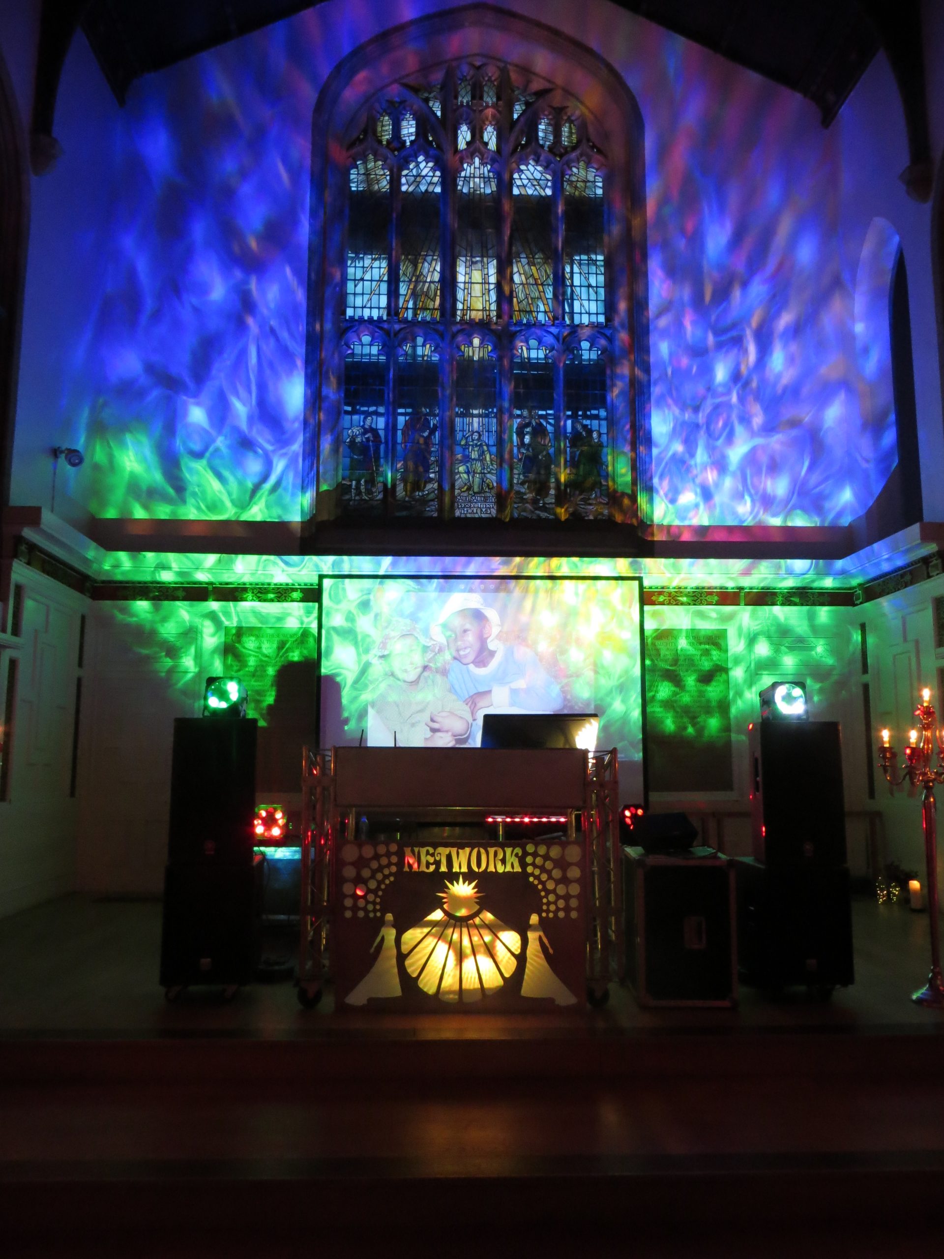 Church wedding with water effect uplighters Wedding DJ For Hire In Norfolk