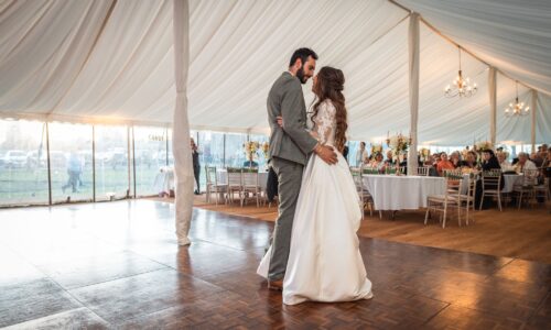 Booking wedding DJ Cambridgeshire — couple first dance at East Anglia wedding reception with DJ Tim providing professional entertainment across four counties