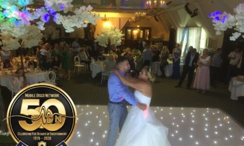 Wedding DJ at Dunston Hall Norwich performing for a first dance on a white starlit dancefloor.