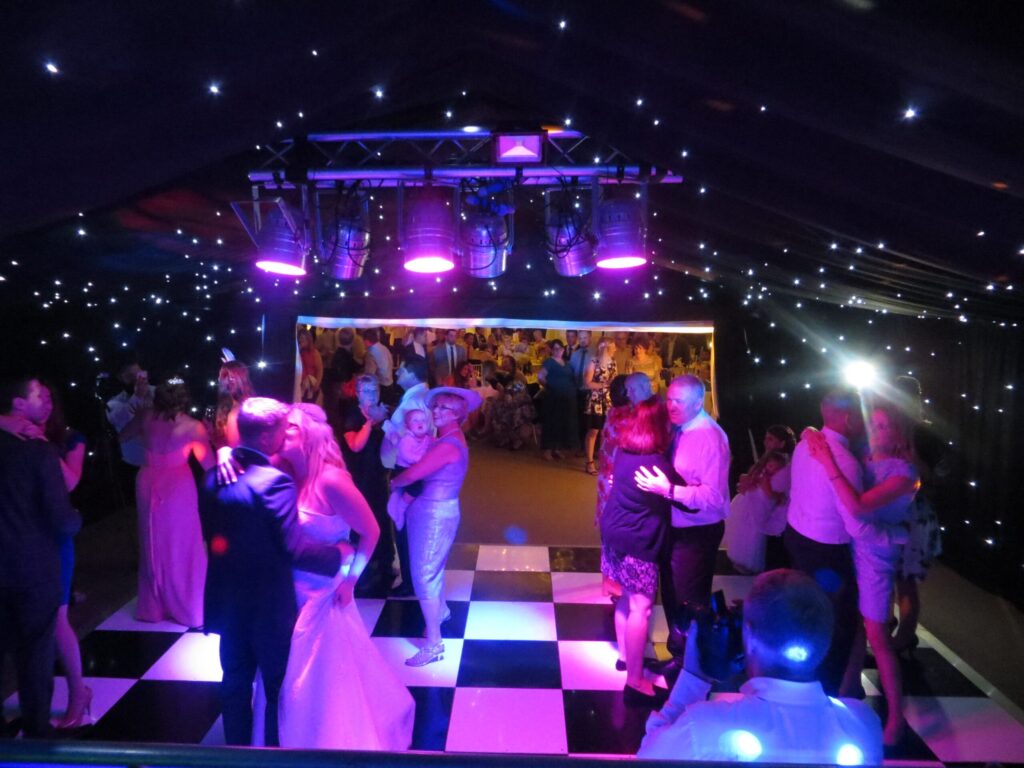 DJ hire Cambridgeshire venues — DJ Tim performing at a Cambridgeshire wedding in 2026