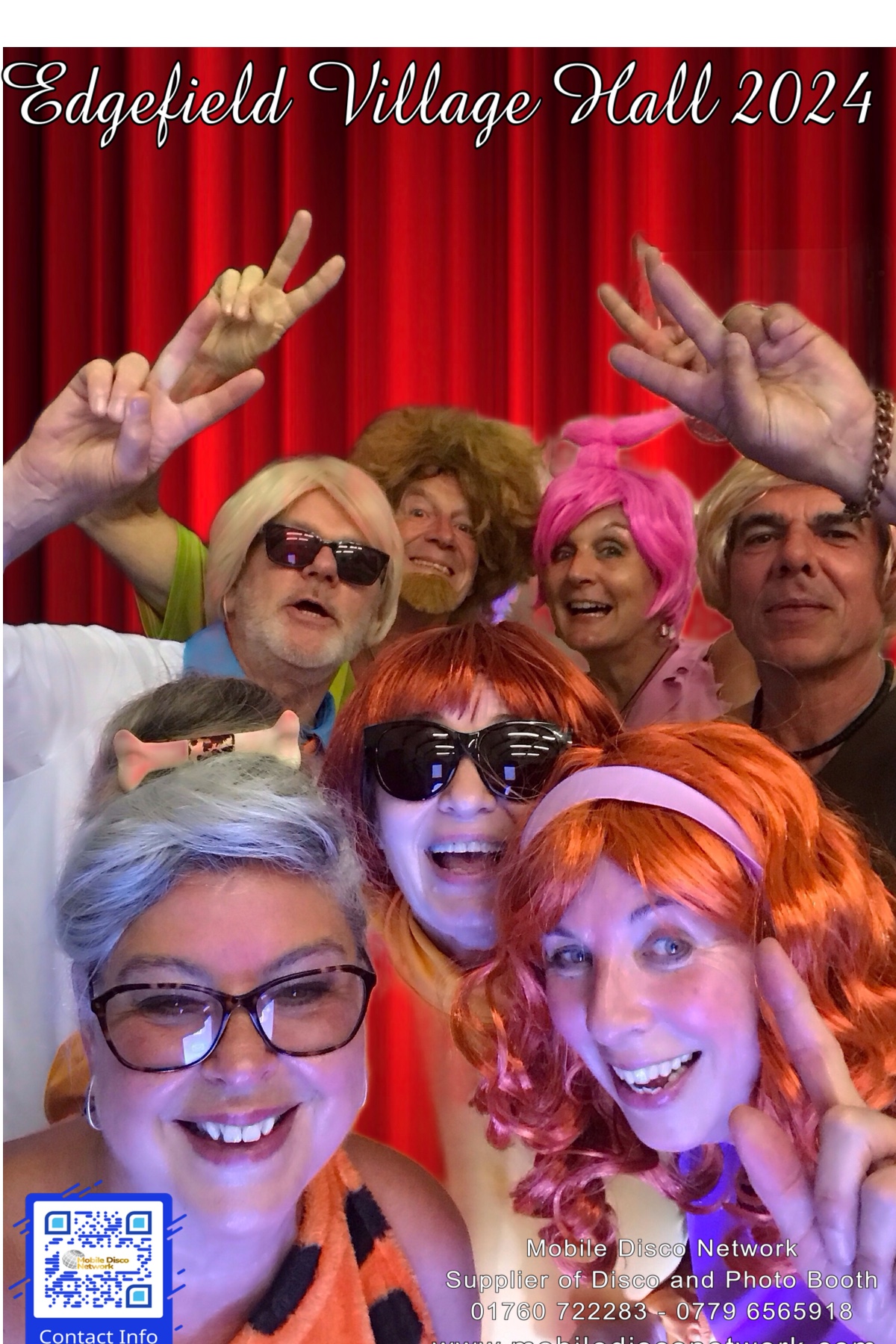 Guests laughing together in the Selfie Pod photo booth at a Norfolk party